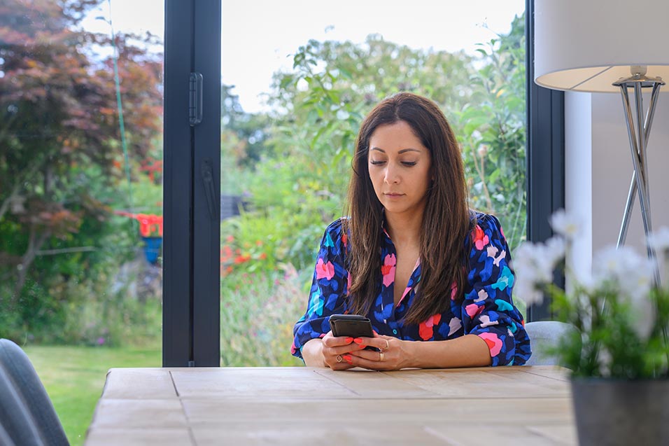 woman looking at her phone