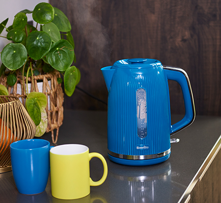 Putting a blue mug in the dishwasher