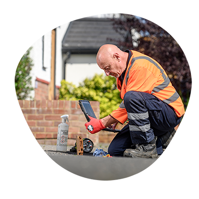 a technician investigating leaks