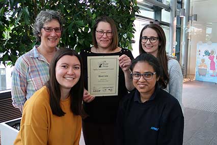Affinity water employees holding the highly commended project prize