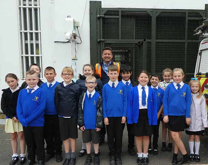 Barton Junior School students standing outside Affinity Waters Drellingore treatment works