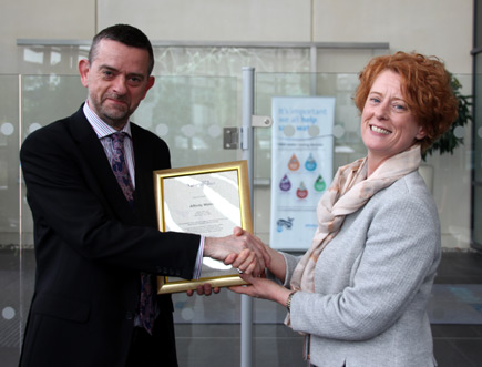 Pauline Walsh receiving the Competent Operator Scheme certification from Nick Ellins