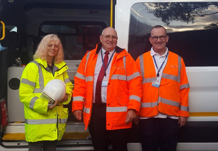 Heather standing next to the incident support vehicle alongside to Customer Service Technicians.