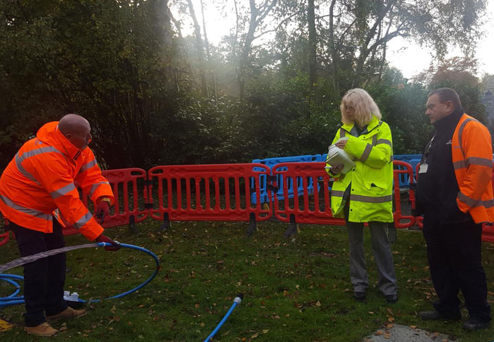 Heather outside with Customer Service Technicians
